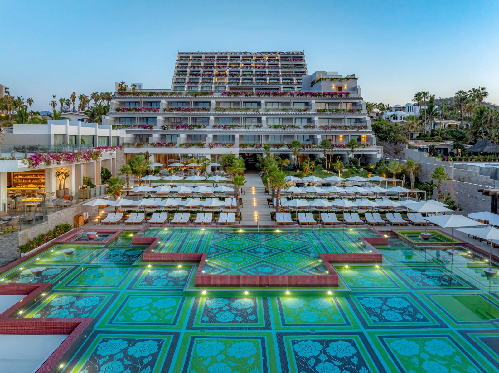 The mosaic infinity pool at Grand Velas Boutique at dusk